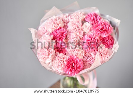 Bunches of pink carnation flowers different varieties in vases. Lovely Vintage background with flowers. Wallpapers. Clove bunch present for Mothers Day.