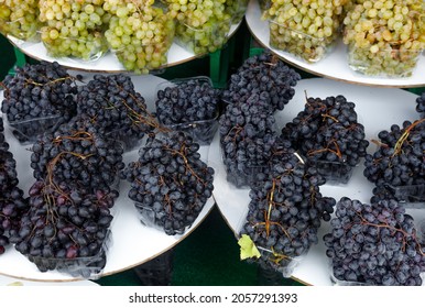 Bunches Of Ripe Juicy Grapes In A Tray On The Counter. The Concept Of Fortification.