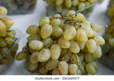 Bunches Of Ripe Juicy Grapes In A Tray On The Counter. The Concept Of Fortification.