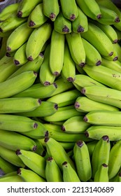 Bunches Of Unripe Banana At Outdoor Market Stall. Sao Paulo City, Brazil.