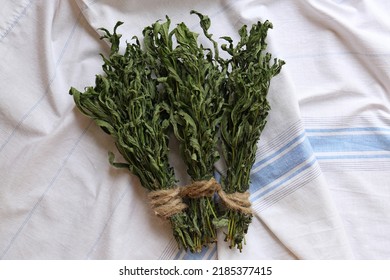 Bunches Of Wilted Mint On White Towel, Flat Lay