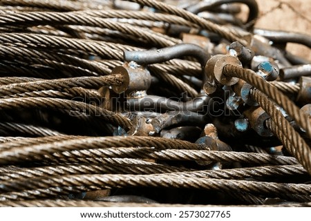 Bunches of wire rope slings with eyeloops in storehouse