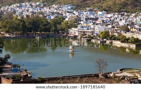 Bundi town and Nawal Sagar lake with small hinduist temple, Rajasthan, India