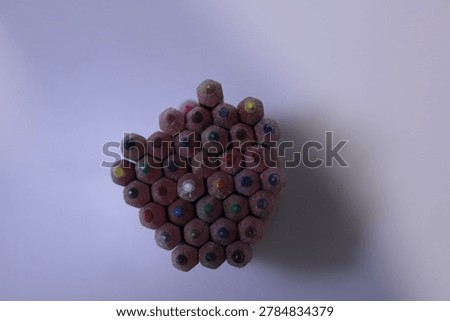 Bundle of colored pencils, Top view of pencil arrangement, Assorted pencil colors