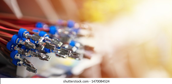 Bundle of crimped cables with electrical connectors. Terminated wire ready to creation connection. Industrial background with copy space for text, soft color effect, banner format