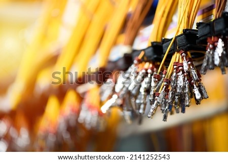 Bundle of crimped cables with electrical connectors. Terminated wire ready for connection. Industrial theme.
