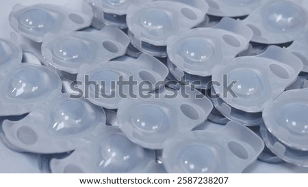 Bundle of daily contact lenses, stack of soft disposal contact lenses for improving eyesight. Myopia control