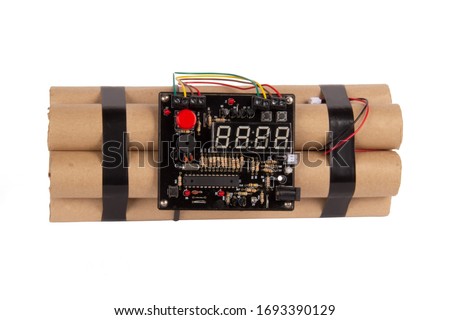 A bundle of dynamite with a microchip, cables and count down display isolated on white background, front view