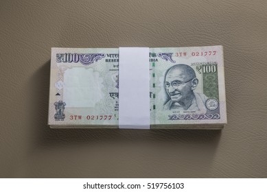 Bundle Of Hundred Rupee Indian Currency Notes Wrapped With White Band.