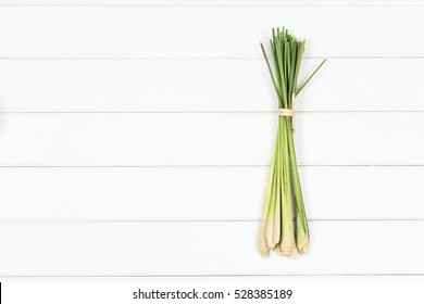 Bundle Of Lemon Grass On White Wood Background, Top View Lemon Grass Photography.