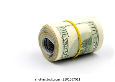 Bundle of money roll of dollars isolated on white background, stack of one hundred dollars American cash money bills rolled up with rubber band. - Shutterstock ID 2191387011