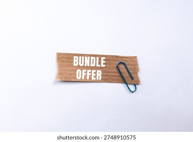 Bundle Offer message written on ripped torn paper background. Conceptual Bundle Offer symbol. Copy space.