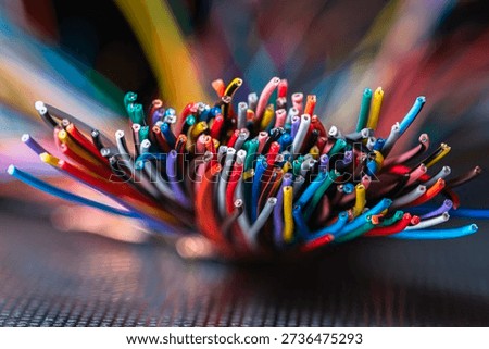 Bundle of thick colorful electrical cables used in telecommunication and information systems. Industrial wiring representing network infrastructure, power distribution, and technical connectivity.