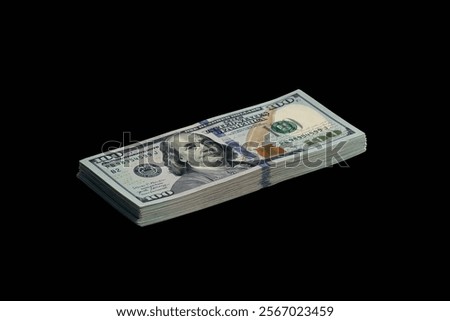 Bundle of US dollar bills isolated on black. Pack of american money with high resolution on perfect black background as object for design