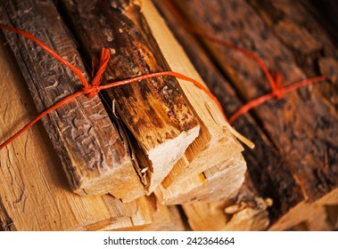 Bundles Of Pine Firewood Closeup Photo. Fireplace Wood.