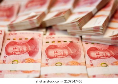 Bundles Of Renminbi. Chairman MAO Zedong's Portrait On The Background Of 100 Yuan, Chinese Banknotes, RMB Banknotes. Chinese Or Asian Economic Growth, Financial Business, The Concept Of A US Trade War