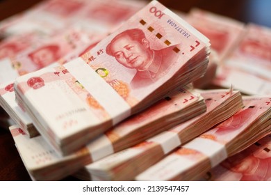 Bundles Of Renminbi. Chairman MAO Zedong's Portrait On The Background Of 100 Yuan, Chinese Banknotes, RMB Banknotes. Chinese Or Asian Economic Growth, Financial Business, The Concept Of A US Trade War