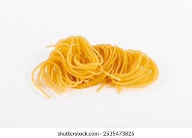 Bundles of uncooked spaghetti are artistically arranged on a textured black slate surface, lightly dusted with flour, creating a rustic culinary scene. - Powered by Shutterstock