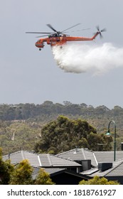 Bundoora, Australia - December 30, 2019: Erickson Air Crane Helicopter Dropping A Large Load Of Water Onto A Bushfire.