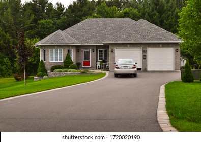 Bungalow / Ranch House With A Lawn And Driveway