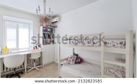 bunk bed and desktop in a bright children's room. solution for small apartments with children. production of furniture to order.