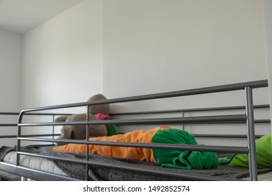 Bunk Metal Bed. Stuffed Toys. Light Wall.