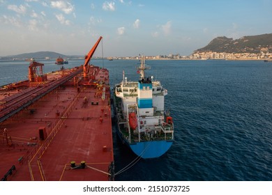 Bunkering operation between bunker vessel and crude oil tanker at Gibraltar anchorage