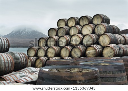 Bunnahabhain distillery, Islay, Scotland. Whisky casks stockpiled outside Bunnahabhain distillery Islay, waiting to be filled. Feb 2017