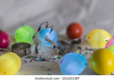 Bunny Cookie Cutter Surrounded By Easter Eggs.