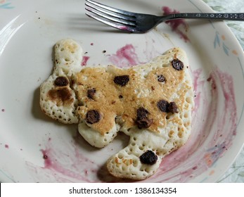 A Bunny Shaped Chocolate Chip Pancake On A Plate       