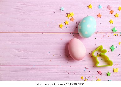 Bunny Shaped Cookie Cutter And Easter Eggs On Color Background