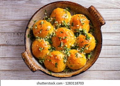 Buns Pampushky - Ukrainian Garlic Bread. Bread Rolls With Garlic And Parsley In Baking Dish. View From Above, Top Studio Shot, Horizontal