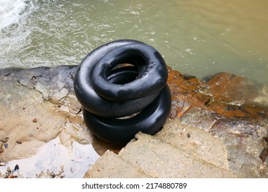 A Buoy From An Inner Tube On The Edge Of A River Bathing Pool