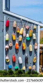 Buoys On A Seaside Home That Are Multicolored As A Nautical Display