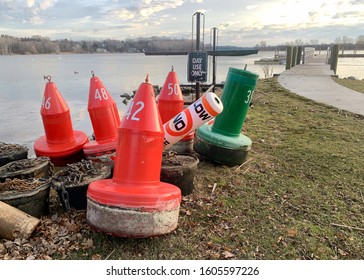 Buoys Stacks On The Shore Of The Saugatuck River In Winter In Michigan 