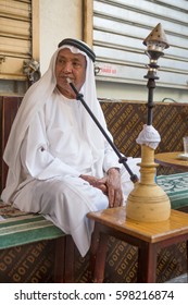 Bur Dude, Dubai, 02/02/2016, A Local Arabic Man Smoking Shisha Early In The Morning At A Local Roadside Cafe.