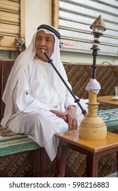 Bur Dude, Dubai, 02/02/2016, A Local Arabic Man Smoking Shisha Early In The Morning At A Local Roadside Cafe.