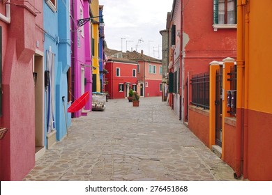 BURANO, ITALY -30 APRIL 2015- Located 4 miles (7 kilometers) from Venice, the island archipelago of Burano in the Venetian lagoon is famous for its charming colorful houses. - Shutterstock ID 276451868