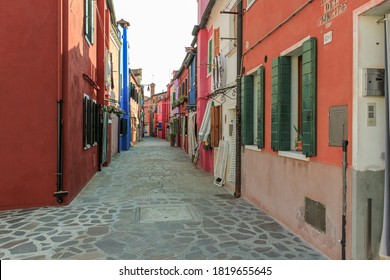 Burano, Italy - July 30, 2020: Unique colorful local neighborhood and building facade details in Burano, Venice - Shutterstock ID 1819655645
