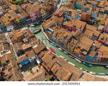 Burano positive colorful rainbow island. City on the water Venice. Drone view