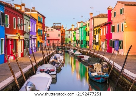 Burano, Venice, Italy colorful buildings along canals at twilight.