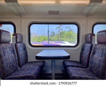 BURBANK, CA, JUN 2020: Side View, Interior Of Empty Metrolink Train Car, Light Rail System Used By Commuters In Southern California. Top Of Local Bus Visible Outside Window