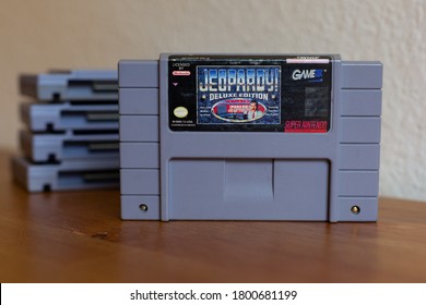 Burbank, California - August 15 2020: A Jeopardy Super Nintendo (SNES) Game, On A Table In A Home.