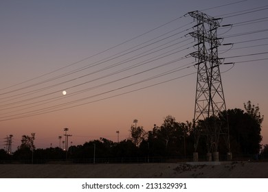 Burbank, California - August 22, 2020: Sunset Featuring Power Lines And The Moon. 