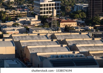 Burbank, California, USA - October 20, 2019:  Morning View Of Historic Sound Stages With Curved Rooftops At The Warner Brothers Studio Lot Near Los Angeles.  