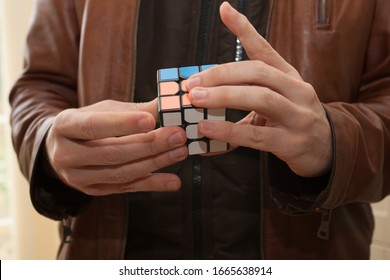 Burford, Oxfordshire, UK 03 04 2020 Man Playing With Rubix Cube