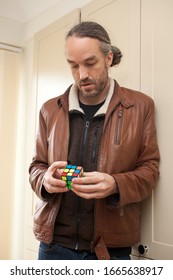 Burford, Oxfordshire, UK 03 04 2020 Man Playing With Rubix Cube