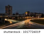 BURGAS, BULGARIA - FEBRUARY 1, 2018: Overhead pedestrian bridge at night. McDonald