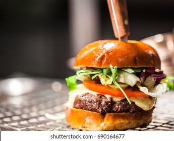 Burger, Beef, Melted Chees, Pickles, Tomatoe, Salad, Resting Tray, Food Ready To Plate, Mouthwatering Food, Brioche Burger Bun