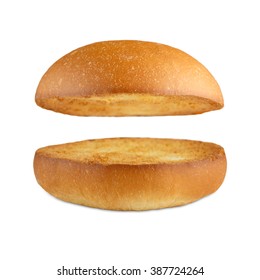 Burger bun empty isolated. American food classic burger round bread isolated at white background. Roasted toasted burger top without fillings flying, levitating at white.  - Shutterstock ID 387724264